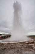 Travel photography:A geysir erupts at the Geysir Centre on the Golden Circle tourist route, Iceland