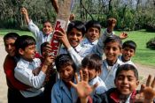 Travel photography:Srinagar kids competing for the best spot in front of the camera, India