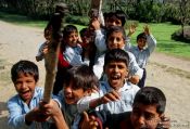 Travel photography:Srinagar kids competing for the best spot in front of the camera, India