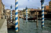 Travel photography:Gondola poles in Rio de Canareggio near Ponte Guglie in Venice, Italy