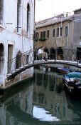 Travel photography:Man drawing from a bridge near Campo de la Madalena in Venice, Italy