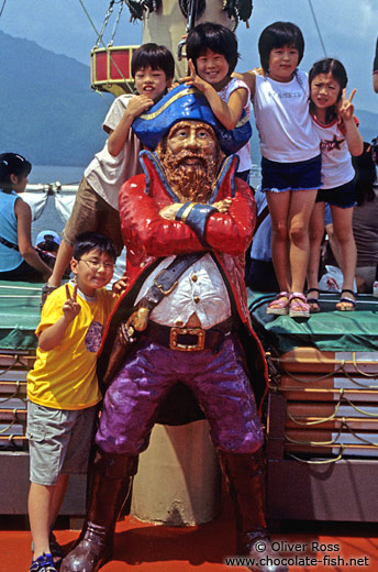 Kids posing on a pirate ship on Lake Hakone