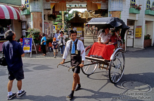 Rickshaw puller with tourists in Tokyo