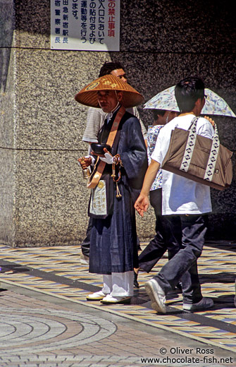 Monk outside the Shinjuku metro station