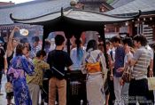 Travel photography:Rubbing in the incense for good luck at Senso-ji temple in Tokyo Asakusa, Japan