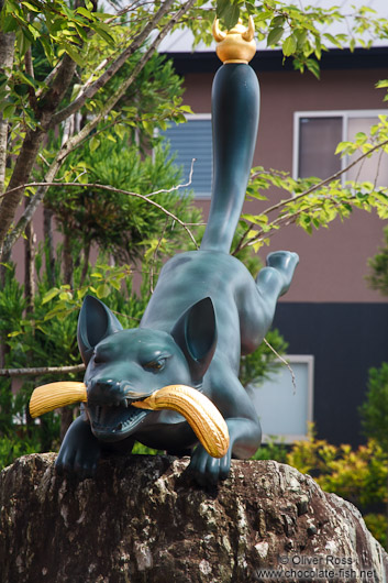Fox sculpture at the entrance to Kyoto`s Inari shrine