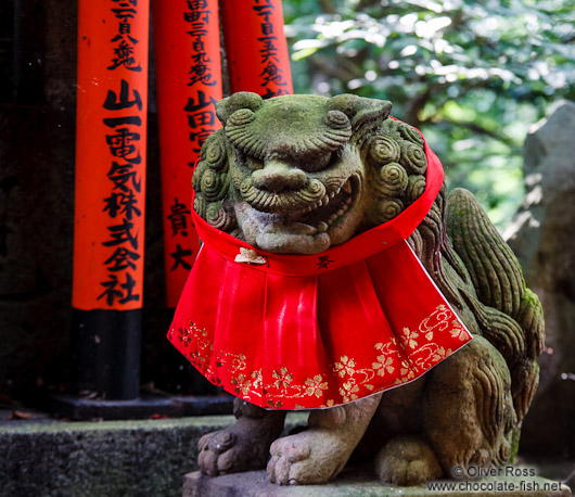 Stone dog sculpture at Kyoto`s Inari shrine