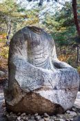 Travel photography:Headless seated Buddha in the Gyeongju Namsan mountains, South Korea