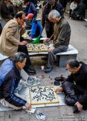 Travel photography:Old men playing Go in a park near the Jongmyo Royal Shrine in Seoul, South Korea