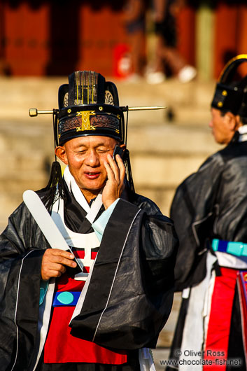 Man on mobile at the Jongmyo Royal Shrine in Seoul