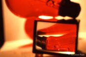 Travel photography:Red light bulbs through a magnifying glass