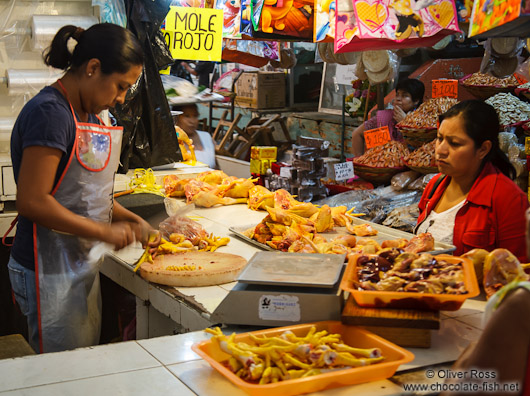 Selling chicken at the Oaxaca market