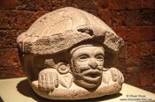 Travel photography:Sculpture of Aztec Macuilxochitl (Xochipilli) (god of songs, dance and music) at the Mexico City Anthropological Museum, Mexico
