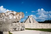 Travel photography:Snake head with Central pyramid at the Chichen Itza archeological site, Mexico