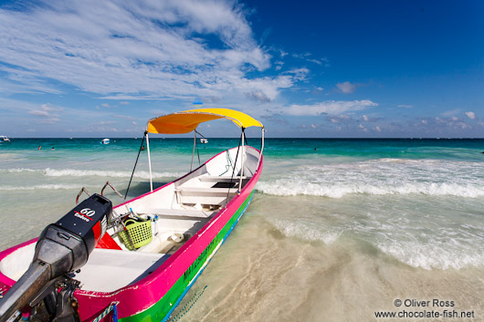 Tourist boat on Tulum beach
