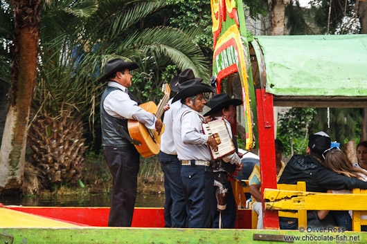 Mariachi provide entertainment on some of the colourful trajineras (rafts) on Lake Xochimilco