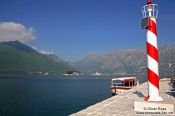 Travel photography:View of Perast harbour with the islands of Sv. Djordje (St. George) and Gospa od Škrpjela (Our Lady of the Rock), Montenegro