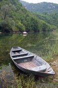 Travel photography:Small fisherman`s boat in Rijeka-Crnojevica, Montenegro