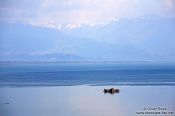 Travel photography:View of Skadarsko jezero (Scutari lake) with isolated monastery, Montenegro