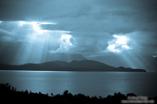 Rays of light break through the clouds in Fiordland National Park