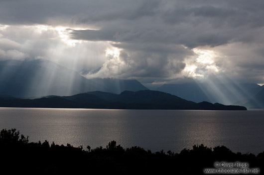 Rays of light break through the clouds in Fiordland National Park