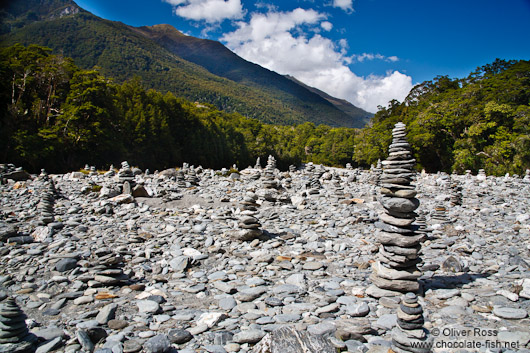 Stone pyramids in a river bed in Mount Aspiring National Park