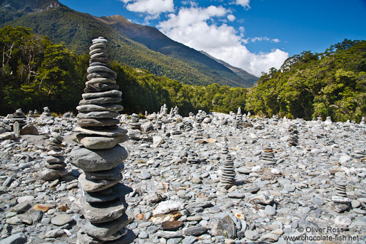 Stone pyramids in a river bed in Mount Aspiring National Park