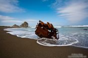 Travel photography:Ship wrek on a beach near Honeycomb Rock, New Zealand