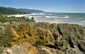 Travel photography:Rainbow over the Punakaiki pancake rocks, New Zealand