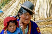 Travel photography:Uros mother with child, Peru