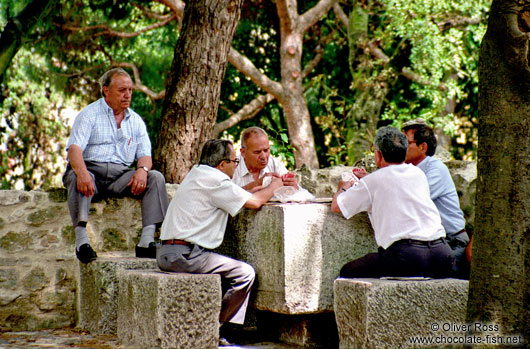 Men Playing Cards in Lisbon`s São Jorge Castle