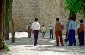 Travel photography:Men passing their time playing "jogo de malha", Portugal