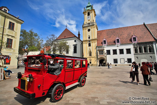Tourist bus in Bratislava´s city centre with old town hall
