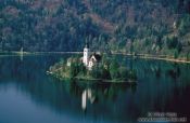 Travel photography:Island with church surrounded by Blejsko jezero (Bled lake), Slovenia