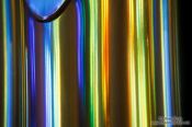 Travel photography:Colourful light from the stained glass windows is reflected off the organ pipes in the Sagrada Familia, Spain