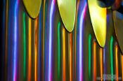 Travel photography:Colourful light from the stained glass windows is reflected off the organ pipes in the Sagrada Familia, Spain