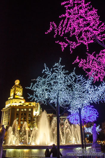 Trees with Christmas decorations at Plaça Catalunya in Barcelona