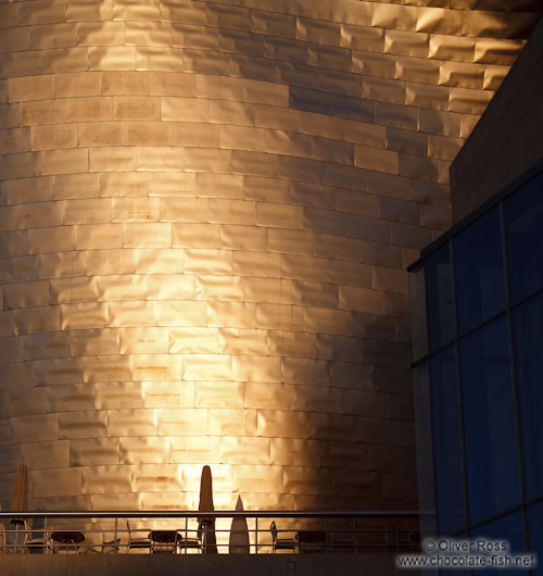 Evening light hits the facade of the Bilbao Guggenheim Museum