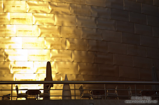 Evening light hits the facade of the Bilbao Guggenheim Museum