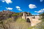 Travel photography:The Puente de Alcantara bridge across the Tajo river in Toledo, Spain