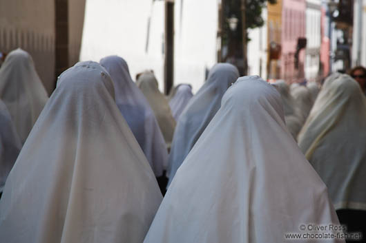 White head scarfs worn by women during the Good Friday procession in Las Palmas