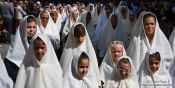 Travel photography:Girls and women duiring the Good Friday procession in Las Palmas, Spain