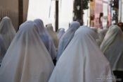 Travel photography:White head scarfs worn by women during the Good Friday procession in Las Palmas, Spain