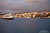 Travel photography:The Queen Mary cruise ship enters Las Palmas harbour at sunrise, Spain