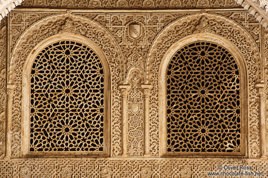 Ornate arabesque windows in the Nazrin palace of the Granada Alhambra