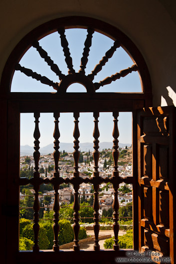 View of Granada through a window at the Generalife of the Granada Alhambra
