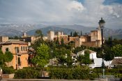 Travel photography:View of the Alhambra from the Albayzin district with the Sierra Nevada in the background, Spain