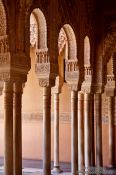 Travel photography:Arches in the Patio de los Leones (Court of the Lions) of the Nazrin palace in the Granada Alhambra, Spain