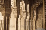 Travel photography:Arches in the Patio de los Leones (Court of the Lions) of the Nazrin palace in the Granada Alhambra, Spain