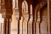 Travel photography:Arches in the Patio de los Leones (Court of the Lions) of the Nazrin palace in the Granada Alhambra, Spain